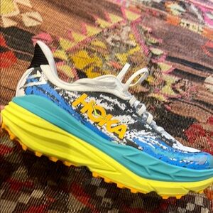Hoka Vibrant Yellow and Turquoise Athletic Shoes with Unique Design